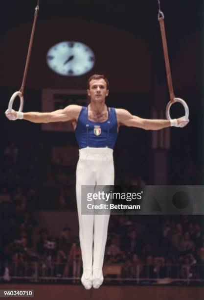 Franco Menichelli of Italy during the Men's Flying Rings event in the gymnastics finals. He placed second and won the silver medal.
