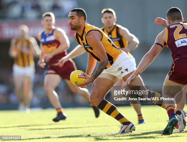 Jarman Impey of the Hawks looks to handball during the 2018 AFL round nine match between the Brisbane Lions and the Hawthorn Hawks at the Gabba on...