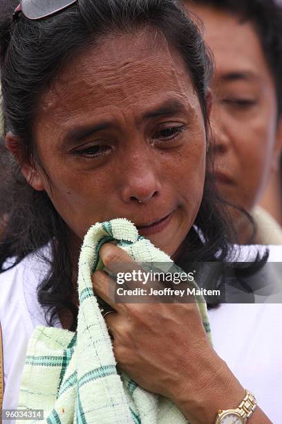 Woman mourns the 57 people killed in a massacre on November 23, 2009 at the site of massacre on January 23, 2010 in the township of Ampatuan,...