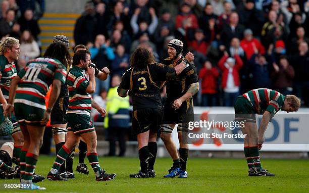 Ospreys captain Ryan Jones celebrates with Adam Jones on the final whistle after the Heineken Cup Round 6 Pool 3 match between Ospreys and Leicester...