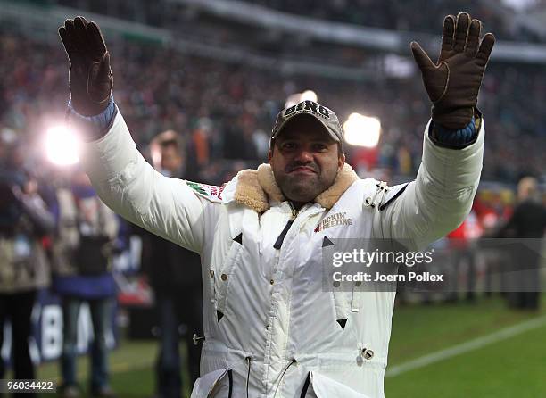 Ailton celebrates with the fans of Bremen during halftime of the Bundesliga match between Werder Bremen and FC Bayern Muenchen at Weser Stadium on...