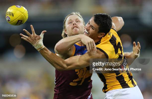 Daniel Rich of the Lions competes with Ryan Burton of the Hawks during the 2018 AFL round nine match between the Brisbane Lions and the Hawthorn...