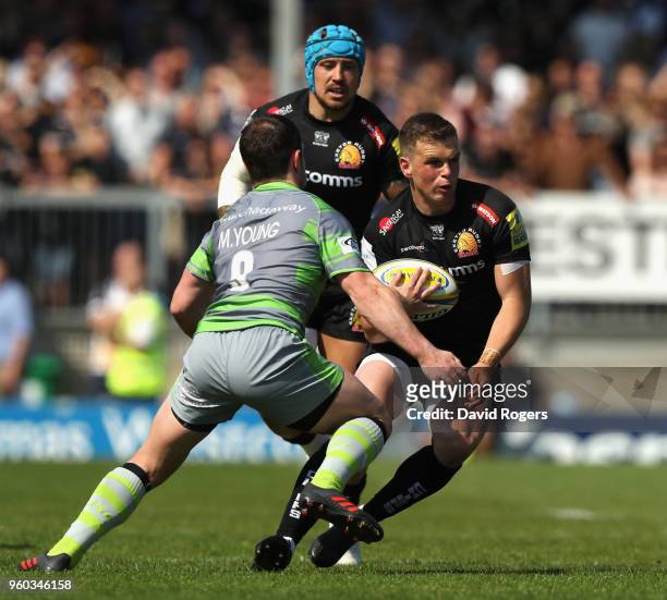 Joe Simmonds of Exeter takes on Micky Young during the Aviva Premiership Semi Final between Exeter Chiefs and Newcastle Falcons at Sandy Park on May...