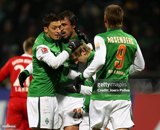 Hugo Almeida of Bremen celebrates with his team mates after scoring his team's second goal during the Bundesliga match between Werder Bremen and FC...