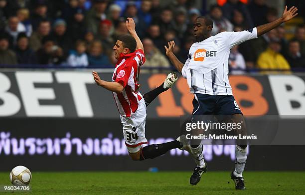 Kyle Walker of Sheffield United is tackled by Fabrice Muamba of Bolton during the FA Cup Sponsored by E.on 4th Round match between Bolton Wanderers...