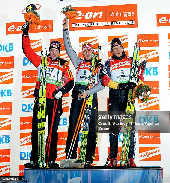 Dominik Landertinger of Austria takes 2nd place, Arnd Peiffer of Germany takes 1st place, Christoph Stephan of Germany takes 3rd place during the...