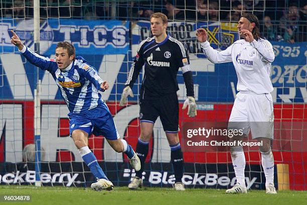 Stanislav Sestak of Bochum celebrates the second goal against Manuel Neuer and Marcelo Bordon of Schalke during the Bundesliga match between VfL...