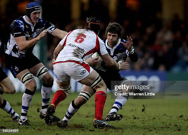 Luke Watson of Bath is tackled by Stephen Ferris of Ulster during the Heineken Cup round six match between Bath Rugby and Uslter Rugby at the...