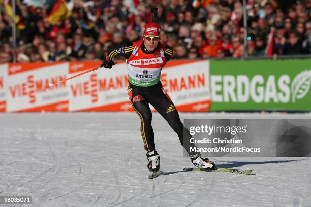 Arnd Peiffer of Germany skis on his way to victory during the men's sprint in the e.on Ruhrgas IBU Biathlon World Cup on January 23, 2010 in...