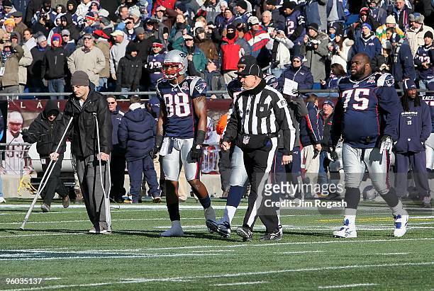 Wes Welker , Sam Aiken and Vince Wilfork of the New England Patriots walk out for the captain's meeting against the Baltimore Ravens during the 2010...