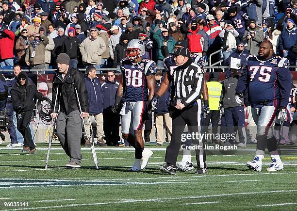 Wes Welker , Sam Aiken and Vince Wilfork of the New England Patriots walk out for the captain's meeting against the Baltimore Ravens during the 2010...