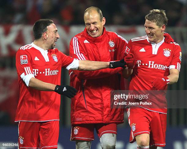 Frank Ribery, Arjen Robben and Bastian Schweinsteiger of Bayern are joking after the Bundesliga match between Werder Bremen and FC Bayern Muenchen at...