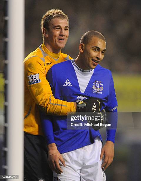 Joe Hart of Birmingham shares a joke with James Vaughan of Everton during the FA Cup 4th Round match between Everton and Birmingham City at Goodison...