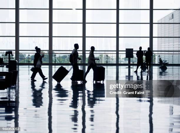 view of airport departures area travellers rushing. - crowded airplane stock pictures, royalty-free photos & images