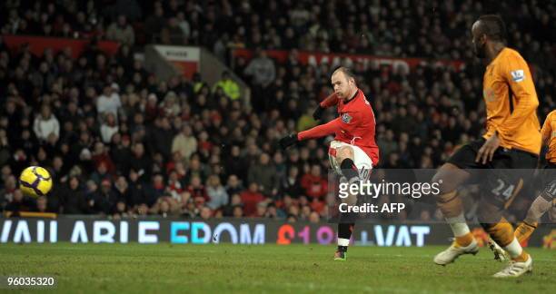 Manchester United's English forward Wayne Rooney scores his second goal during the English Premier League football match between Manchester United...