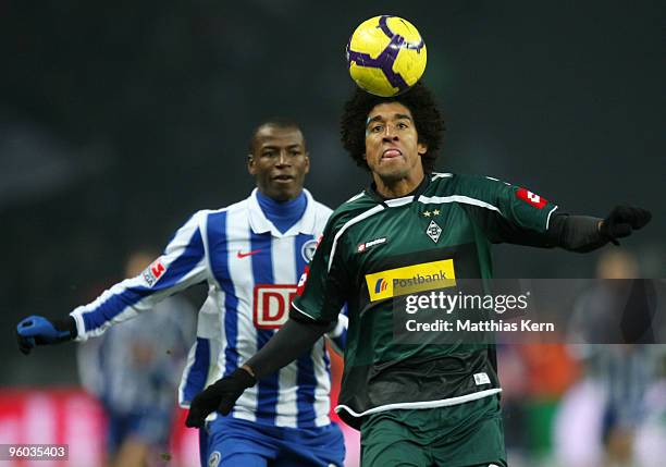 Adrian Ramos of Berlin battles for the ball with Dante of Moenchengladbach during the Bundesliga match between Hertha BSC Berlin and Borussia...