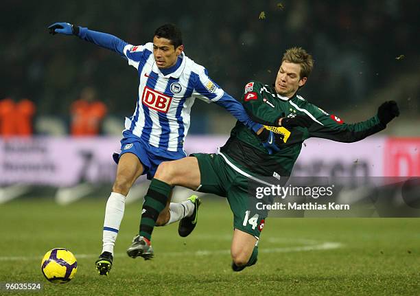 Cicero of Berlin battles for the ball with Thorben Marx of Moenchengladbach during the Bundesliga match between Hertha BSC Berlin and Borussia...