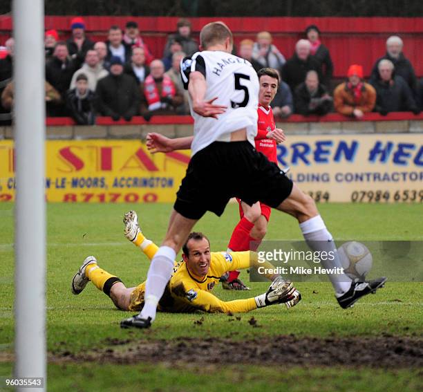 Goalkeeper Mark Schwarzer of Fulham watches as Brede Hangeland stops a cross from Robert Grant of Accrington Stanley during the FA Cup Sponsored by...