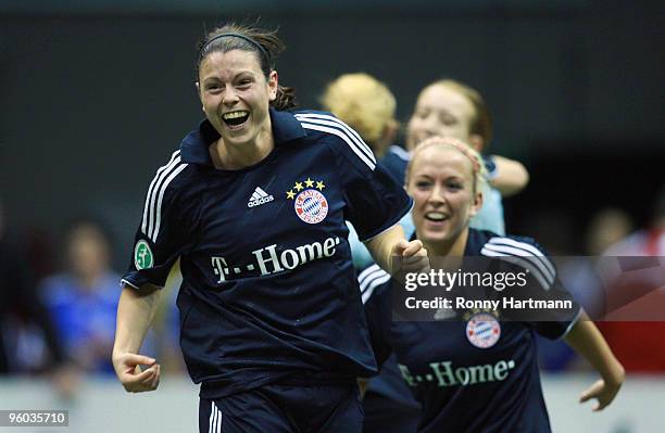 Isabell Bachor and Mandy Islacker of FC Bayern Muenchen celebrate after winning the quarter final match against 1. FFC Frankfurt during the T-Home...