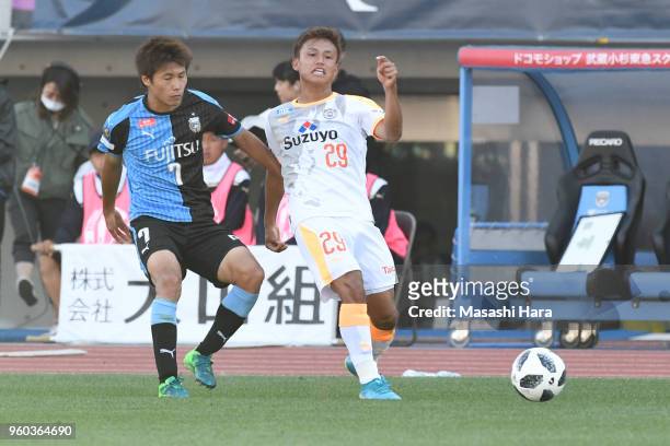 Hideki Ishige of Shimizu S-Pulse and Shintaro Kurumaya of Kawasaki Frontale compete for the ball during the J.League J1 match between Kawasaki...