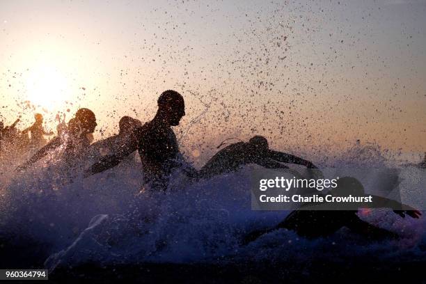 Participants compete in the swim leg of the race during IRONMAN 70.3 Barcelona on May 20, 2018 in Barcelona, Spain.