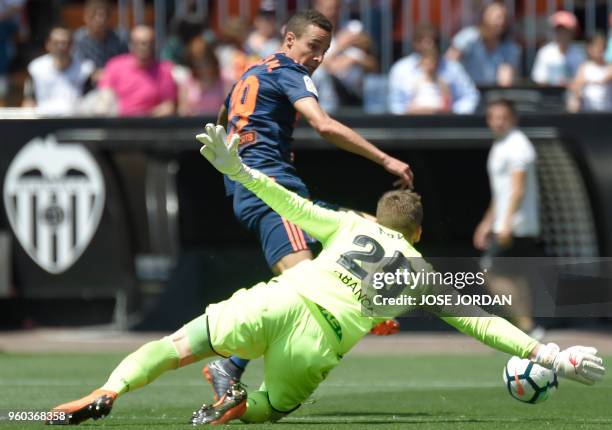 Valencia's Brazilian-born Spanish forward Rodrigo Moreno vies with Deportivo La Coruna's Ukrainian goalkeeper Maksym Koval during the Spanish league...