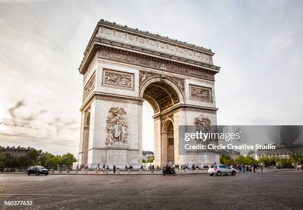 triumphal arch of the star (arc de triomphe de l'etoile) in paris, france - arc de triompe stock pictures, royalty-free photos & images