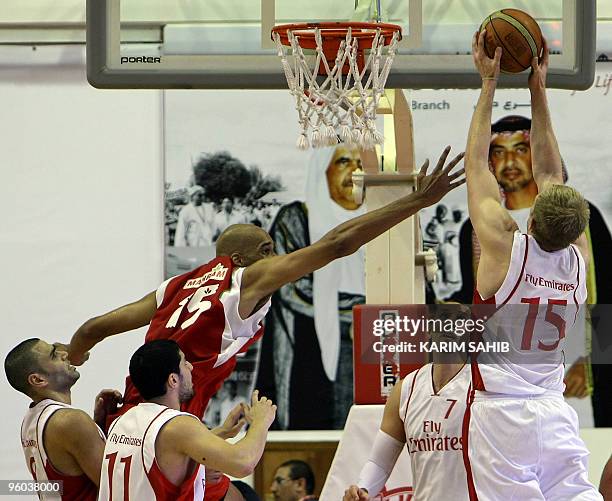 Loren Woods of Iran's Mahram club tries to block a shot by Matt Freije of Lebanon's Al-Riyadi Sporting club during their Dubai International...