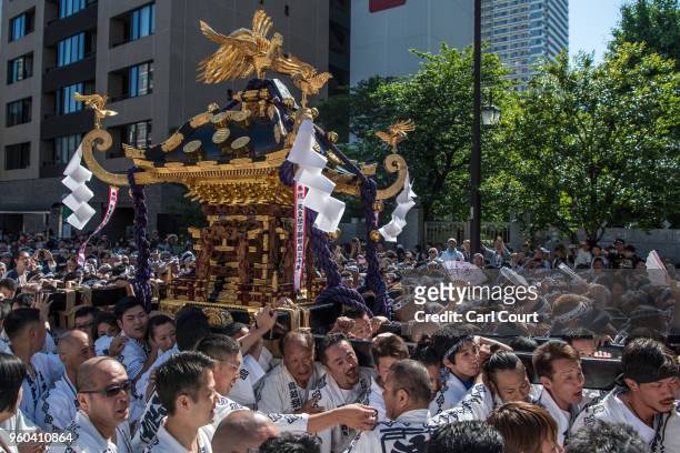 Participants carry a mikoshi near Asakusa Temple on the third and final day of Sanja Festival, on May 20, 2018 in Tokyo, Japan. Sanja Festival is one...