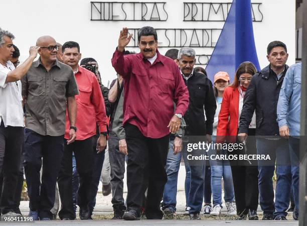 Venezuelan President Nicolas Maduro waves outside a polling station during the presidential elections in Caracas on May 20, 2018. Venezuelans headed...