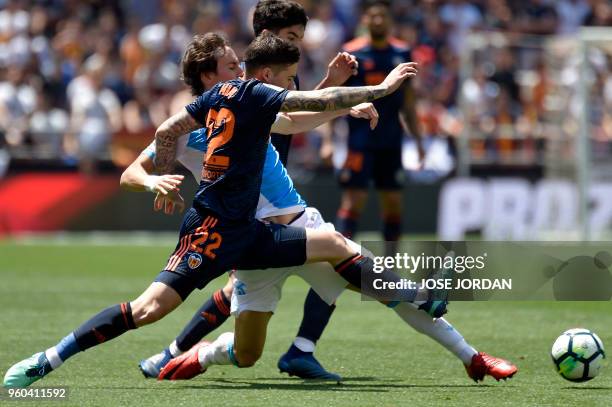 Deportivo La Coruna's Spanish midfielder Pedro Mosquera vies with Valencia's Spanish forward Santi Mina during the Spanish league football match...