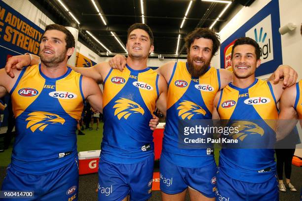 Jack Darling, Tom Barrass, Josh Kennedy and Liam Duggan of the Eagles sing the club song after winning the round nine AFL match between the West...