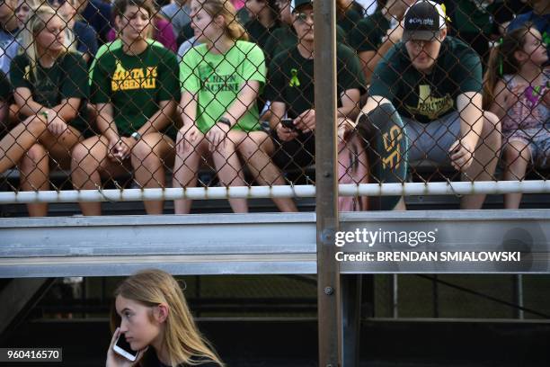 Fans of the Santa Fe HS baseball team attend a makeup game a day after the mass shooting May 19, 2018 in Deer Park, Texas. - Ten people, mostly...
