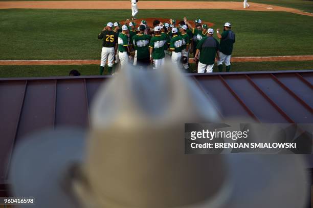 Texas State Trooper attends a Santa Fe HS baseball makeup game a day after the mass shooting May 19, 2018 in Deer Park, Texas. - Ten people, mostly...
