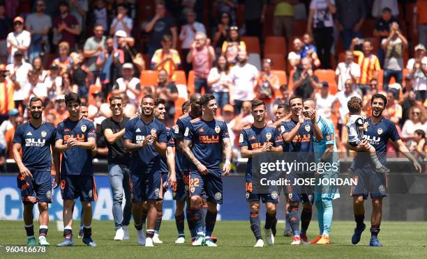Valencia players celebrate their win at the end of the Spanish league football match between Valencia CF and RC Deportivo de la Coruna at the...