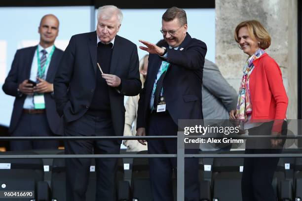 President Reinhard Grindel and German Interior Minister Horst Seehofer chat prior to the DFB Cup final between Bayern Muenchen and Eintracht...