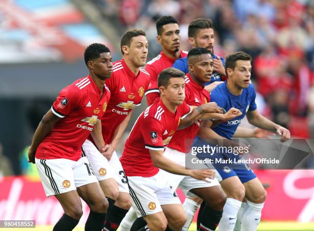 Chelsea players join a Manchester United defensive wall during the Emirates FA Cup Final between Chelsea and Manchester United at Wembley Stadium on...