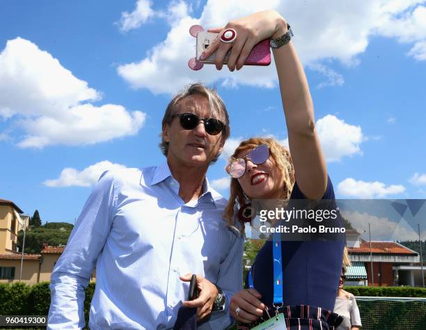 Italy head coach Roberto Mancini with a fan takes a selfie attends the Italian Football Federation 'KickOff' seminar at 'centro tecnico federale di...
