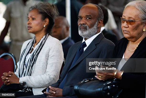 Haitian President Rene Preval and his wife Elisabeth attend a funeral Mass at the collapsed Notre Dame Cathedral for Monsignor Joseph Serge Miot,...