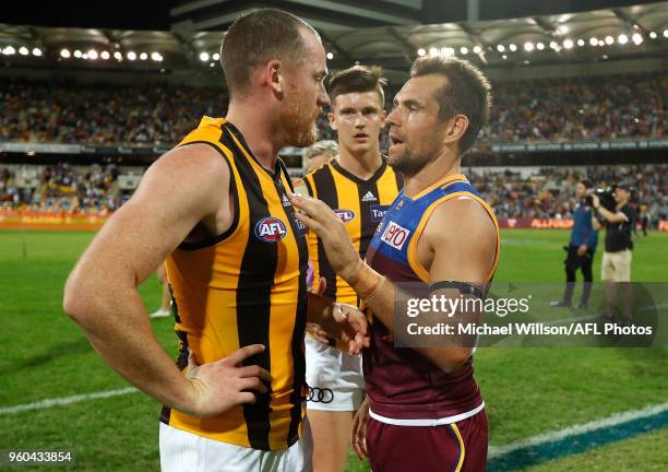 Luke Hodge of the Lions and Jarryd Roughead of the Hawks embrace after the 2018 AFL round nine match between the Brisbane Lions and the Hawthorn...