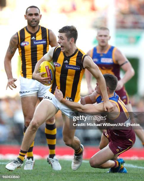 James Cousins of the Hawks is tackled by Dayne Zorko of the Lions during the 2018 AFL round nine match between the Brisbane Lions and the Hawthorn...