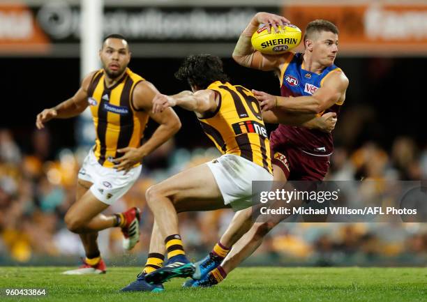 Dayne Zorko of the Lions and Isaac Smith of the Hawks in action during the 2018 AFL round nine match between the Brisbane Lions and the Hawthorn...