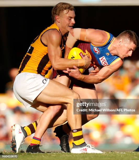 James Worpel of the Hawks and Dayne Zorko of the Lions compete for the ball during the 2018 AFL round nine match between the Brisbane Lions and the...