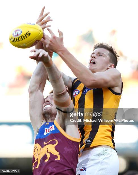 Darcy Gardiner of the Lions and Mitchell Lewis of the Hawks compete for the ball during the 2018 AFL round nine match between the Brisbane Lions and...