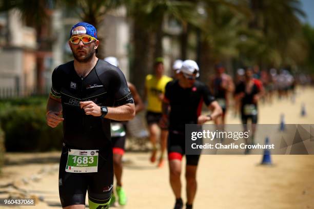 Participants compete in the run leg of the race during IRONMAN 70.3 Barcelona on May 20, 2018 in Barcelona, Spain.