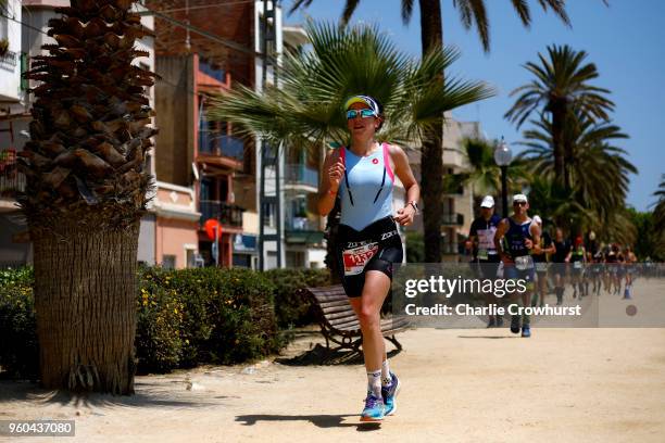 Participants compete in the run leg of the race during IRONMAN 70.3 Barcelona on May 20, 2018 in Barcelona, Spain.