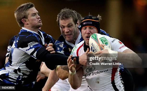 Stephen Ferris of Ulster is tackled during the Heineken Cup round six match between Bath Rugby and Uslter Rugby at the Recreation Ground on January...
