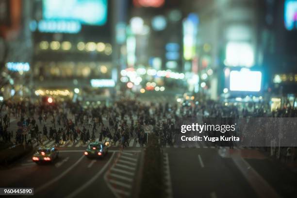 shibuya crossing in the evening (tilt-shift) - yuga kurita stock pictures, royalty-free photos & images