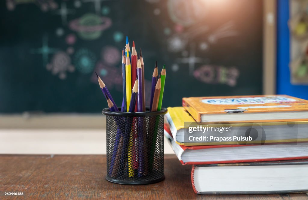 School books on desk, education concept