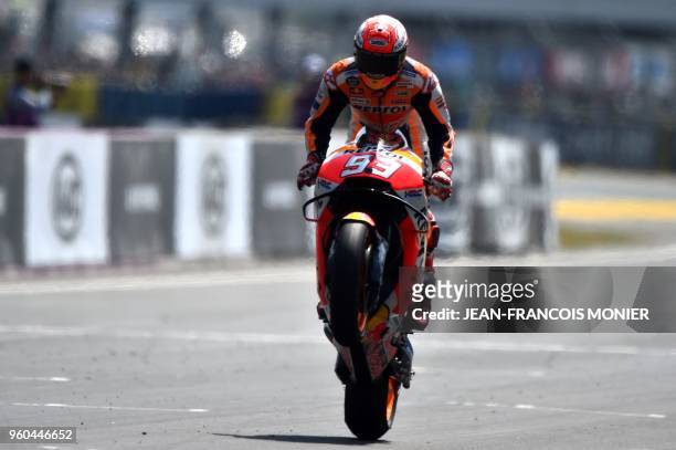 Repsol Honda Team's Spanish rider Marc Marquez crosses the finish line after winning the MotoGP race, of the French motorcycling Grand Prix, on May...